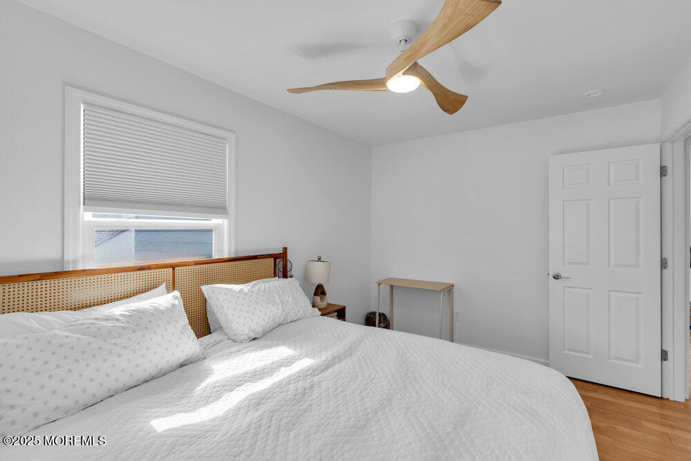 234 3rd Avenue Manasquan, NJ 08736 - Photo 18 of 25 a bedroom with a bed and a window