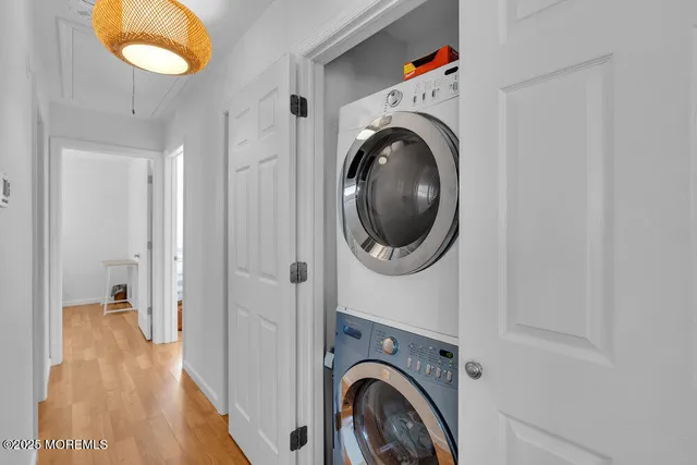 a view of a hallway with washer and dryer