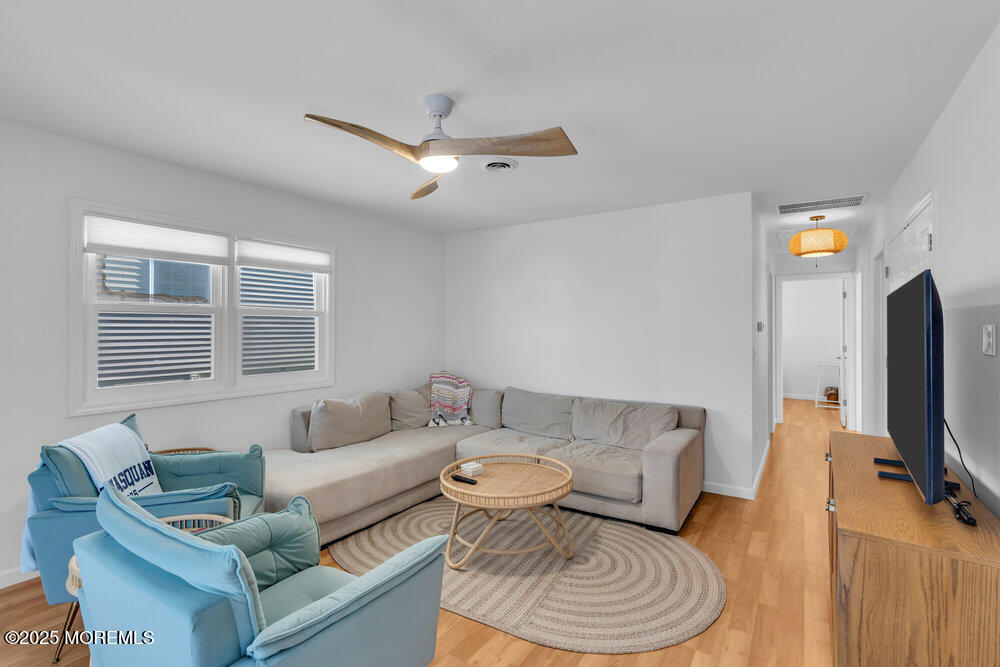 234 3rd Avenue Manasquan, NJ 08736 - Photo 4 of 25 a living room with furniture and a flat screen tv