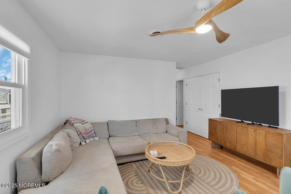234 3rd Avenue Manasquan, NJ 08736 - Photo 5 of 25 a living room with furniture and a flat screen tv