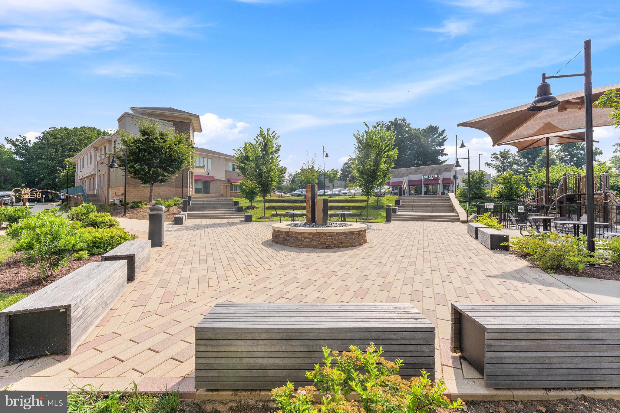 1669 Bandit Loop, Unit 101A Reston, VA 20190 - Photo 33 of 35 a view of a swimming pool with a patio