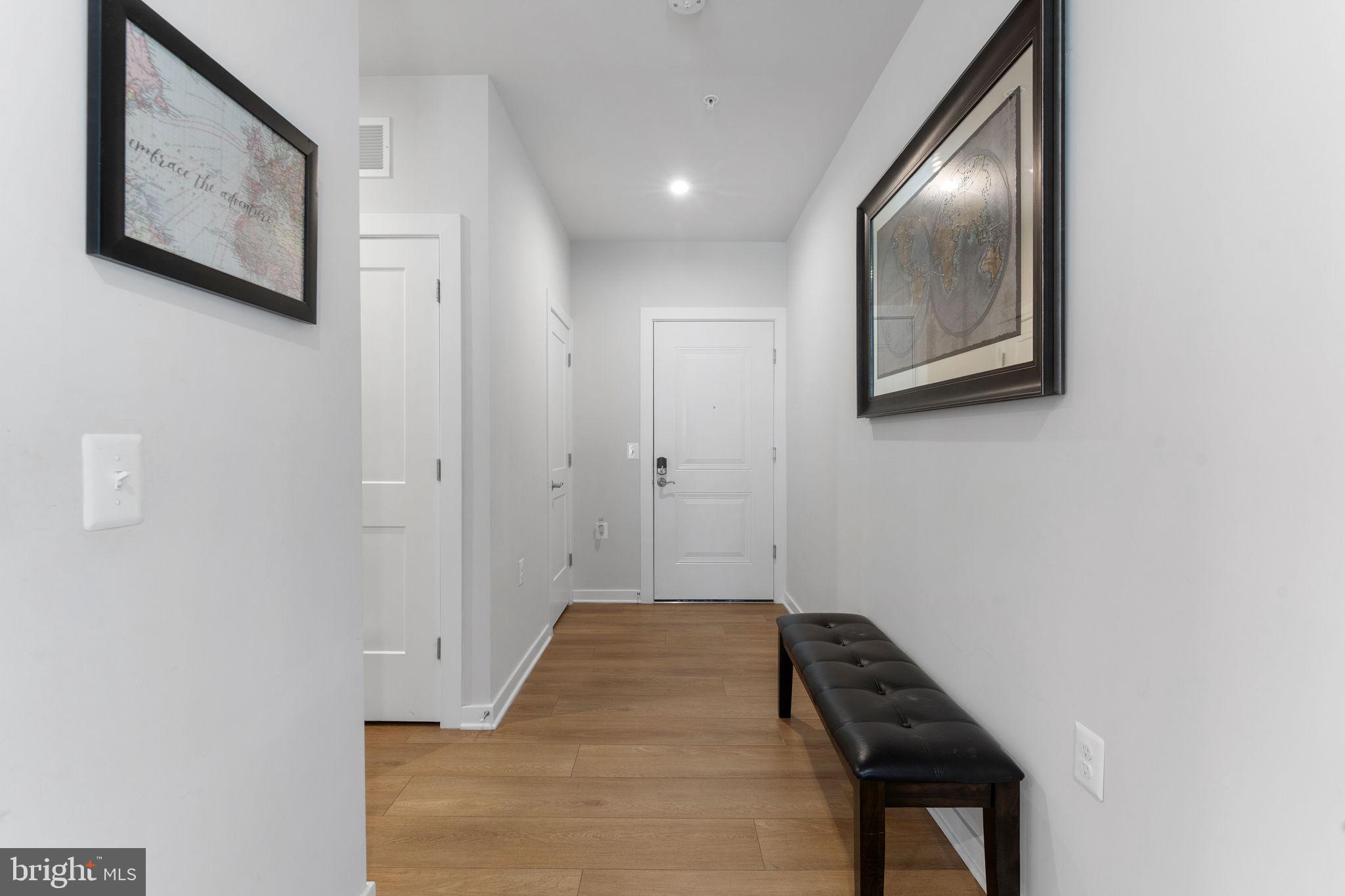 1669 Bandit Loop, Unit 101A Reston, VA 20190 - Photo 6 of 35 a view of a hallway with entryway