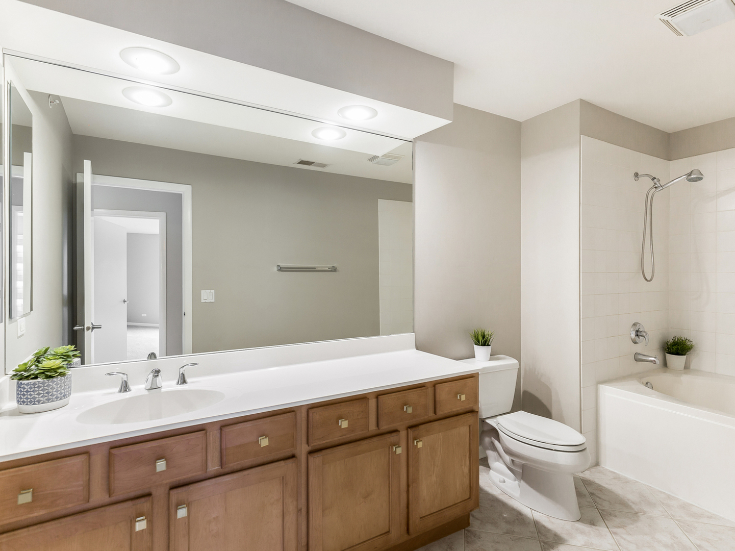 1940 Brentwood Road Northbrook, IL 60062 - Photo 11 of 22 a bathroom with a sink a toilet and shower