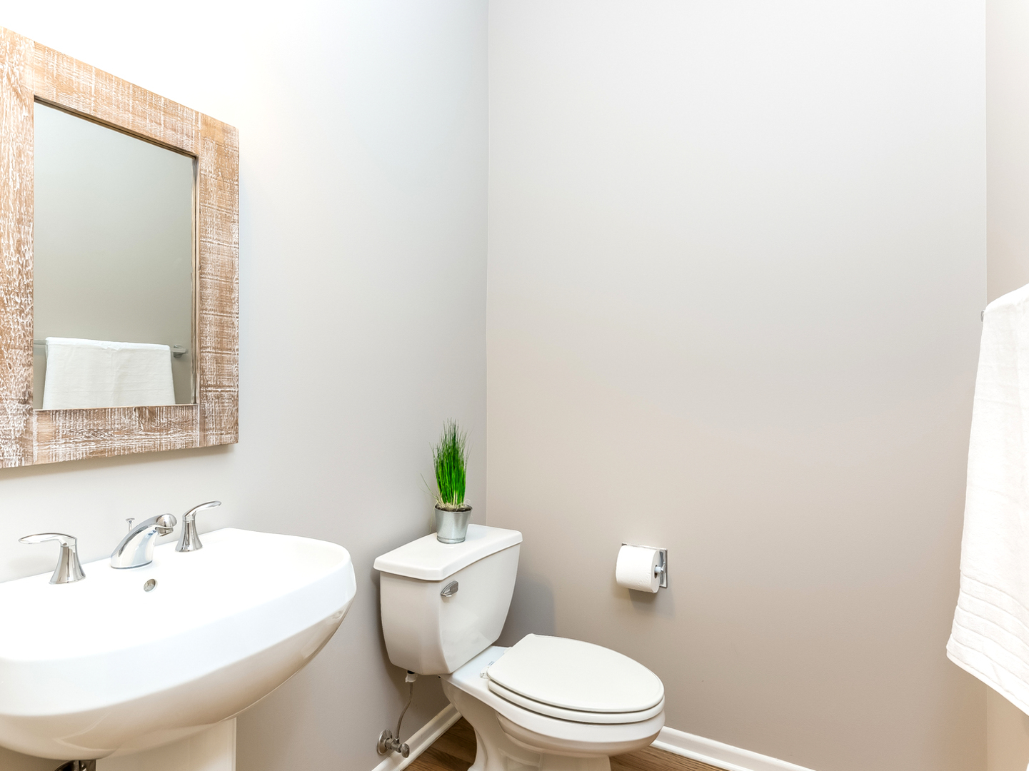 1940 Brentwood Road Northbrook, IL 60062 - Photo 7 of 22 a white toilet sitting next to a bathroom sink