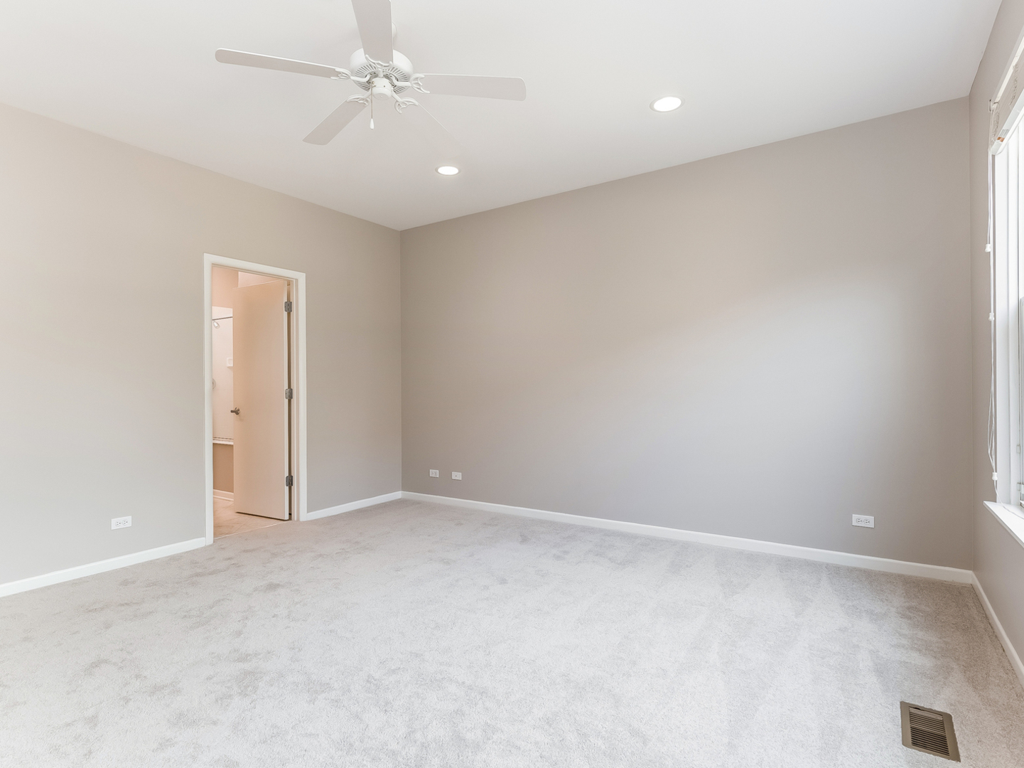 1940 Brentwood Road Northbrook, IL 60062 - Photo 8 of 22 an empty room with a ceiling fan and carpet