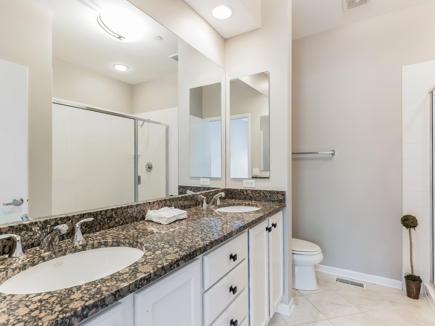1940 Brentwood Road Northbrook, IL 60062 - Photo 9 of 22 a bathroom with a granite countertop sink and a mirror