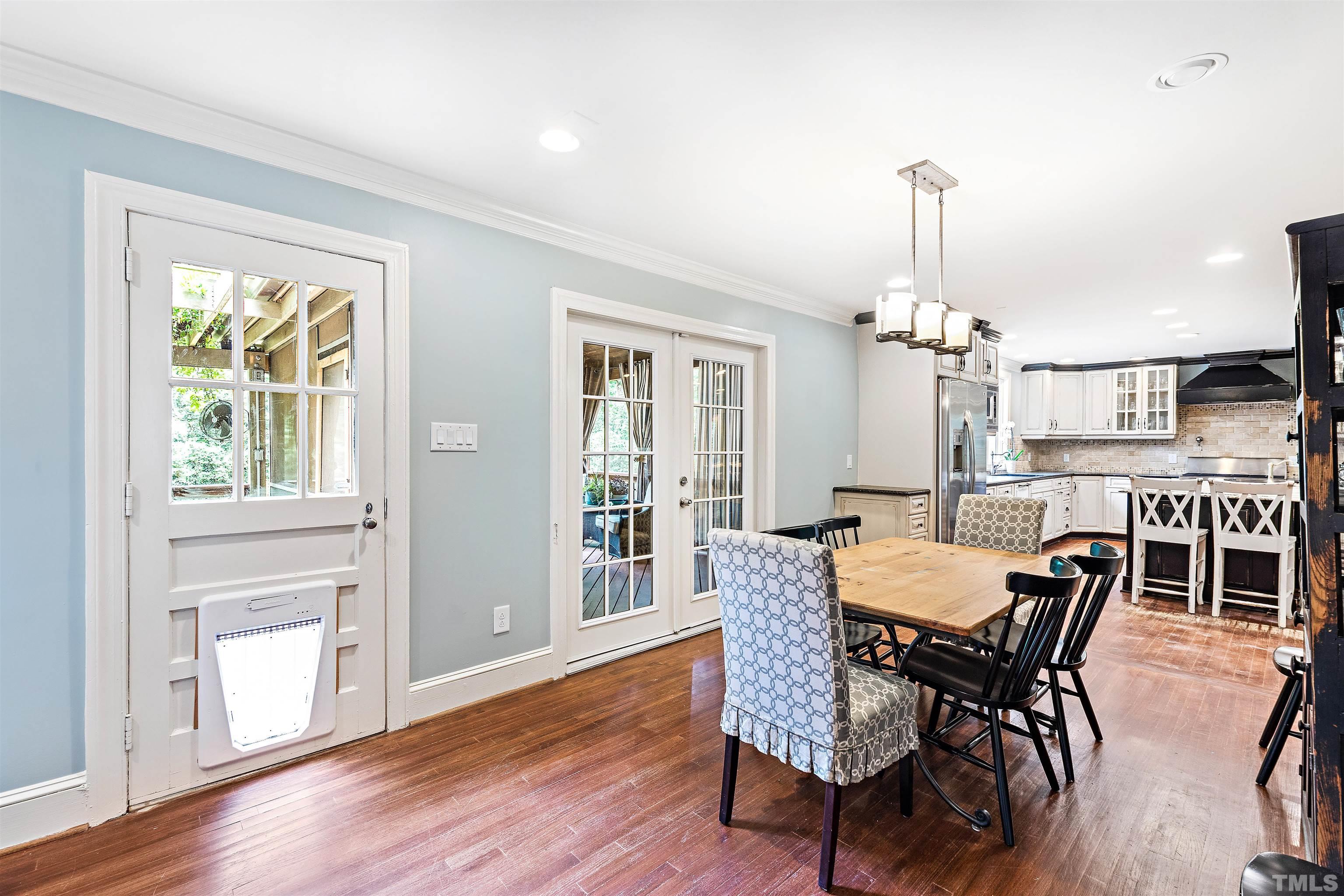 1419 Lutz Avenue Raleigh, NC 27607 - Photo 14 of 56 a view of a dining room with furniture window and wooden floor