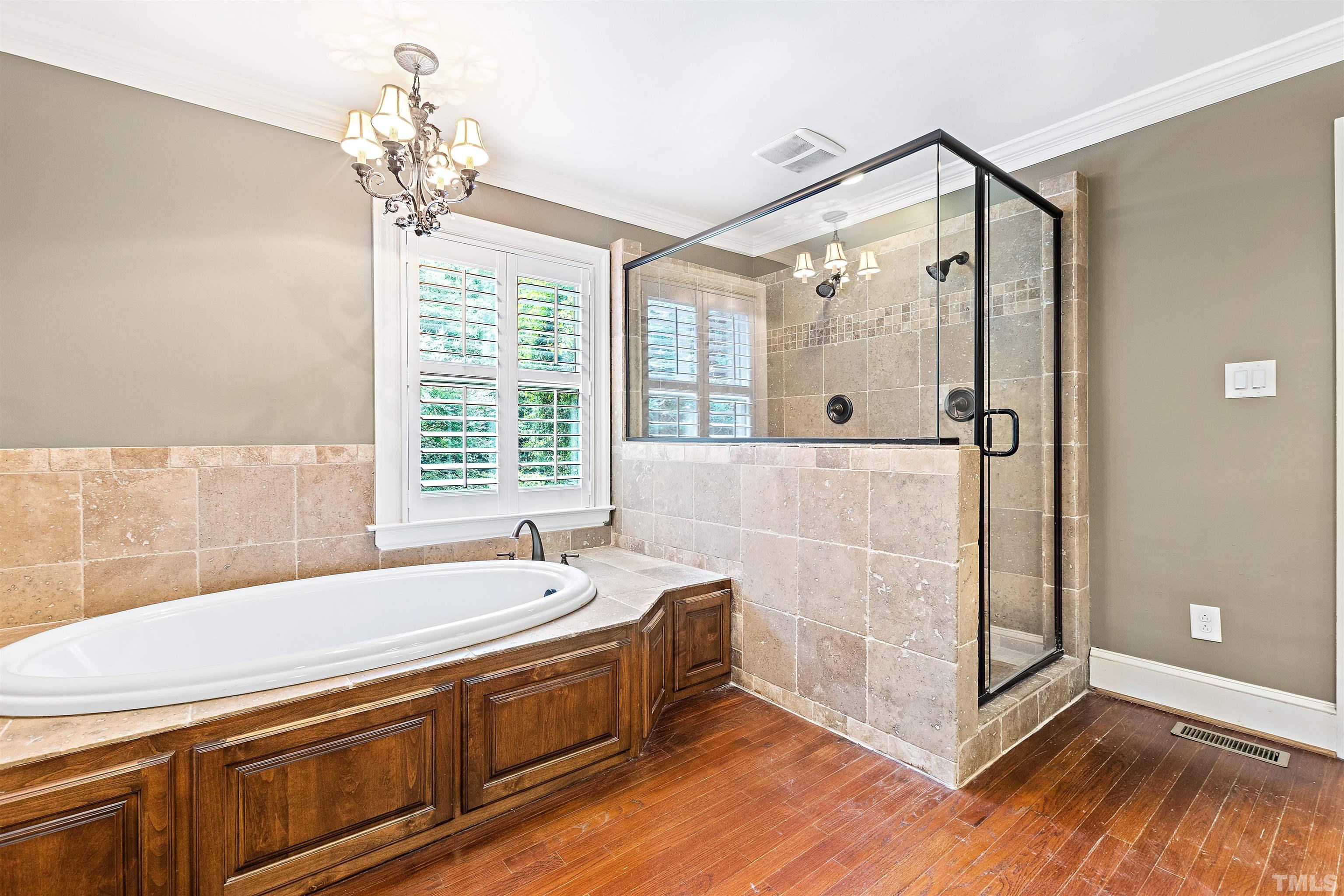 1419 Lutz Avenue Raleigh, NC 27607 - Photo 22 of 56 a spacious bathroom with a tub shower and sink