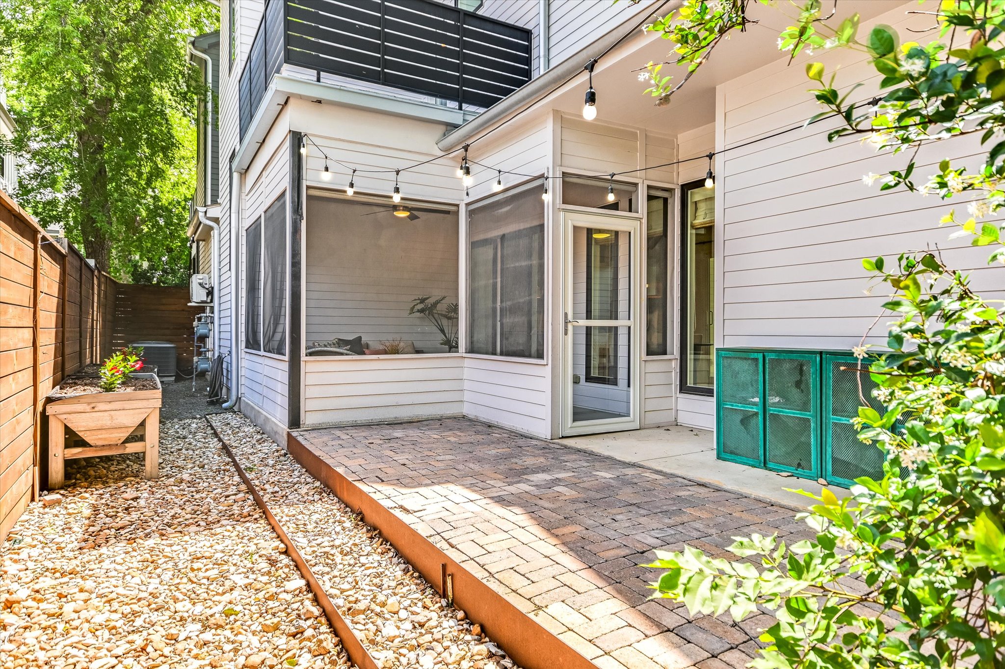 1605 Hether Street Austin, TX 78704 - Photo 6 of 26 Outdoor patio area featuring brick pavers and a screened porch