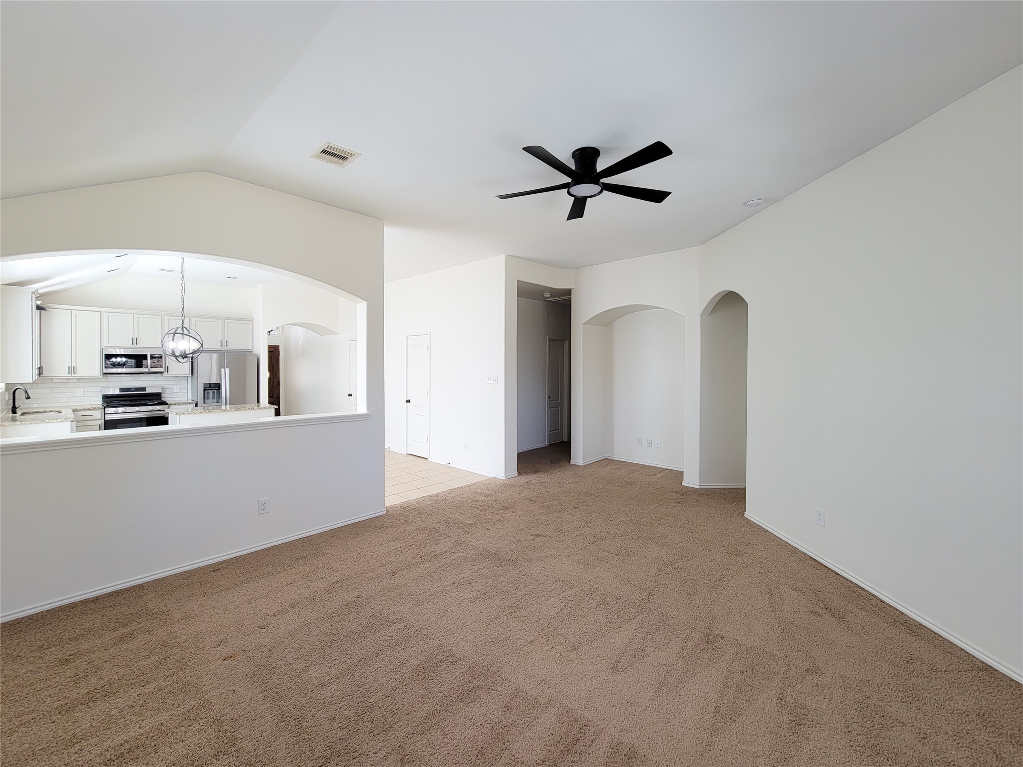13935 Kenswick Key Lane Houston, TX 77047 - Photo 13 of 33 a view of a kitchen with a sink and cabinets