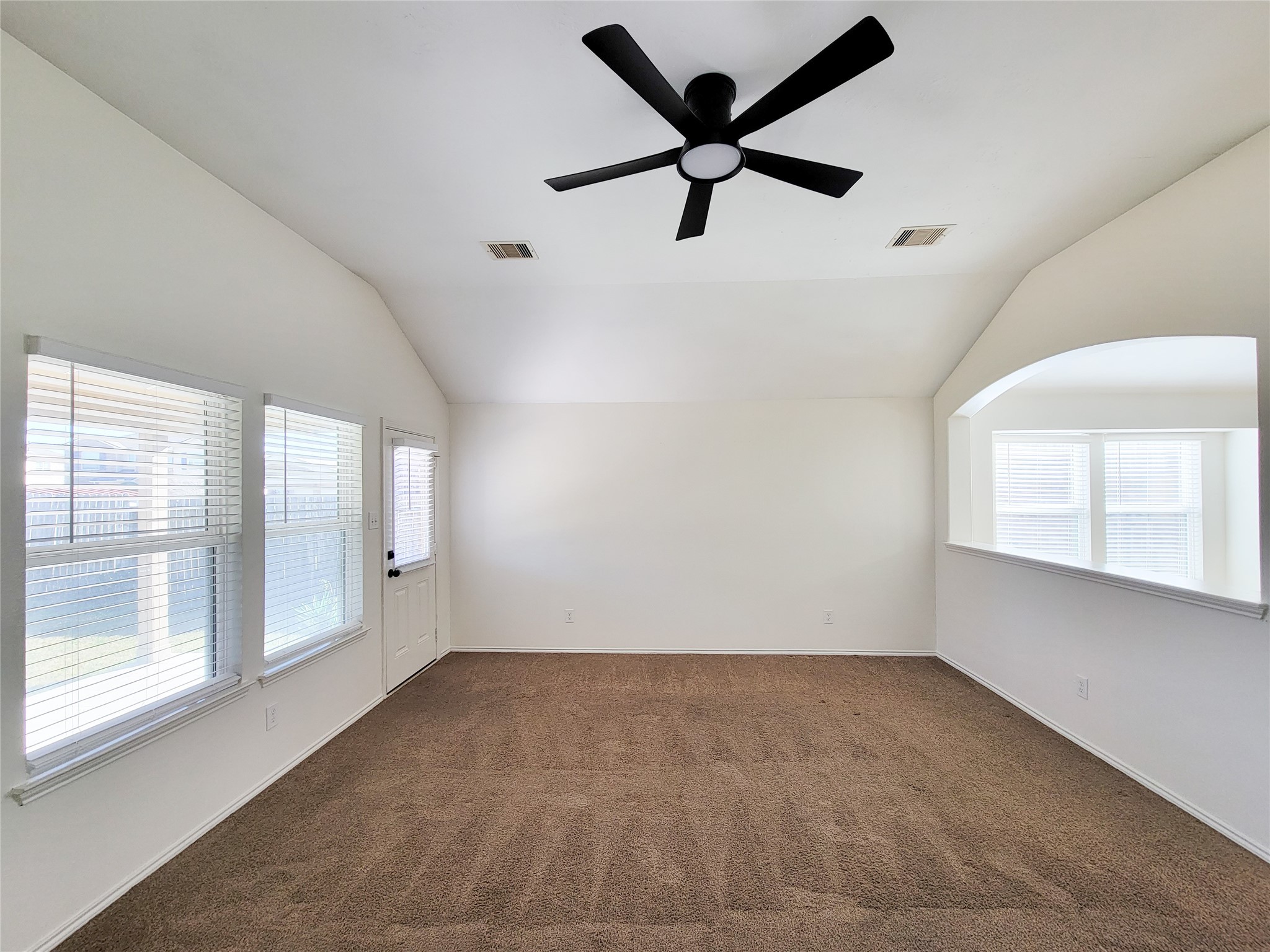13935 Kenswick Key Lane Houston, TX 77047 - Photo 14 of 33 wooden floor in an empty room with a window