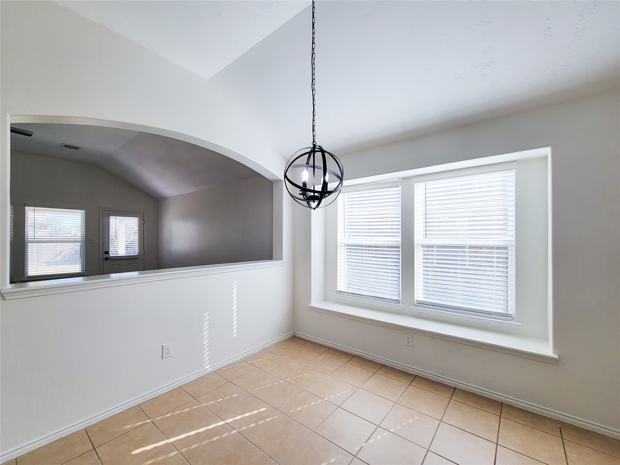 13935 Kenswick Key Lane Houston, TX 77047 - Photo 17 of 33 a view of an empty room with a window