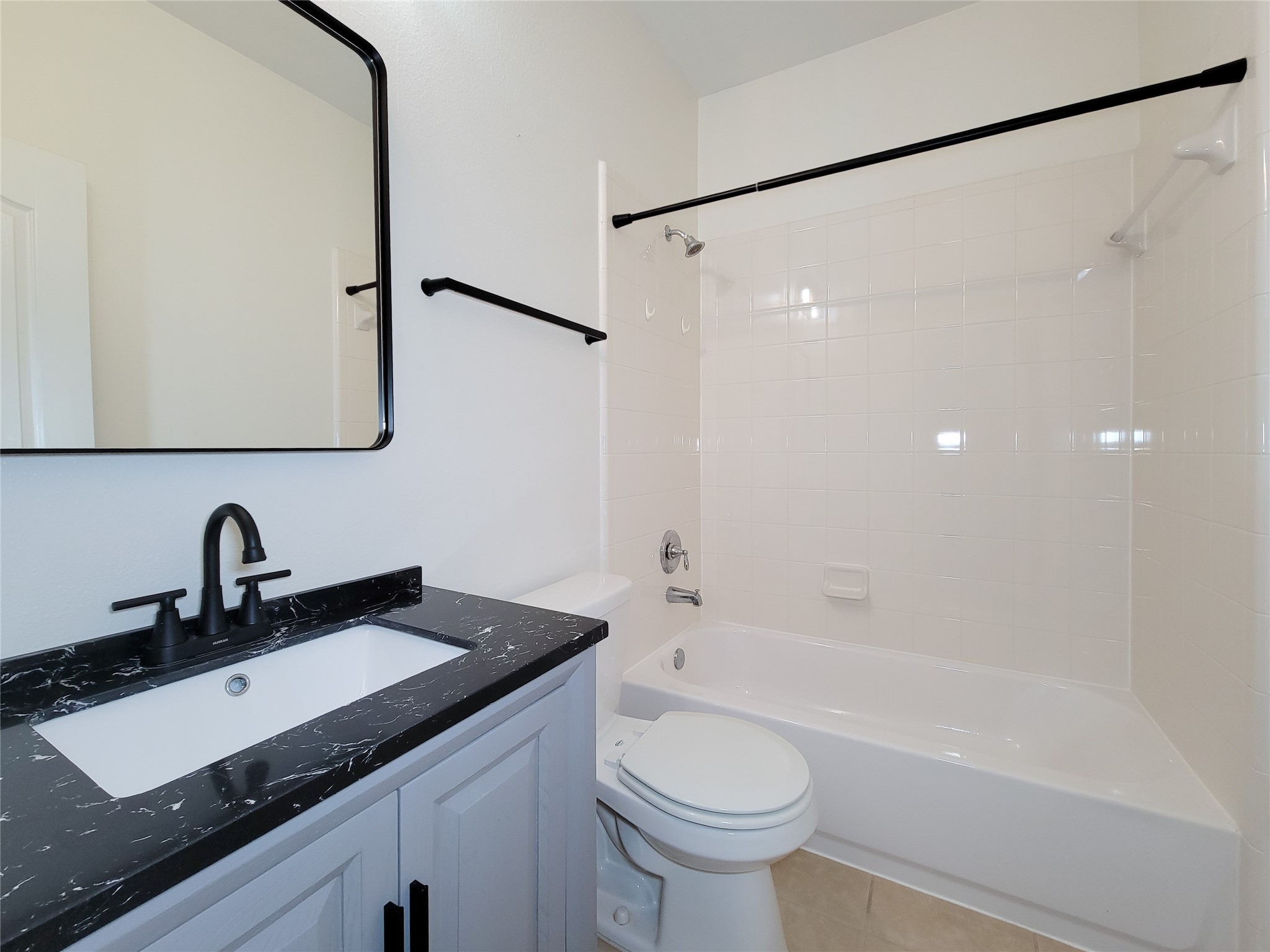 13935 Kenswick Key Lane Houston, TX 77047 - Photo 28 of 33 a bathroom with a sink and a mirror
