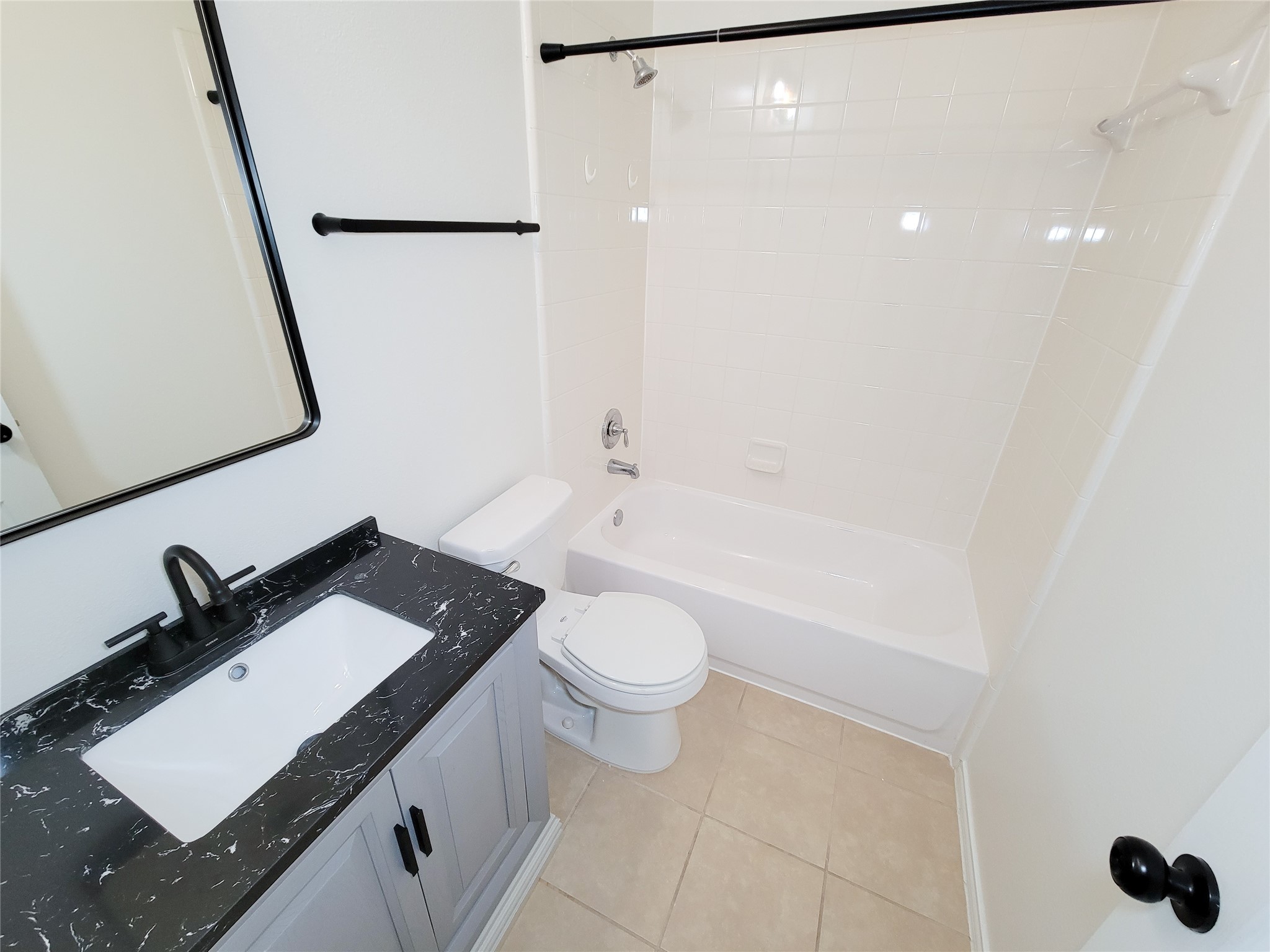 13935 Kenswick Key Lane Houston, TX 77047 - Photo 29 of 33 a bathroom with a granite countertop sink toilet and shower