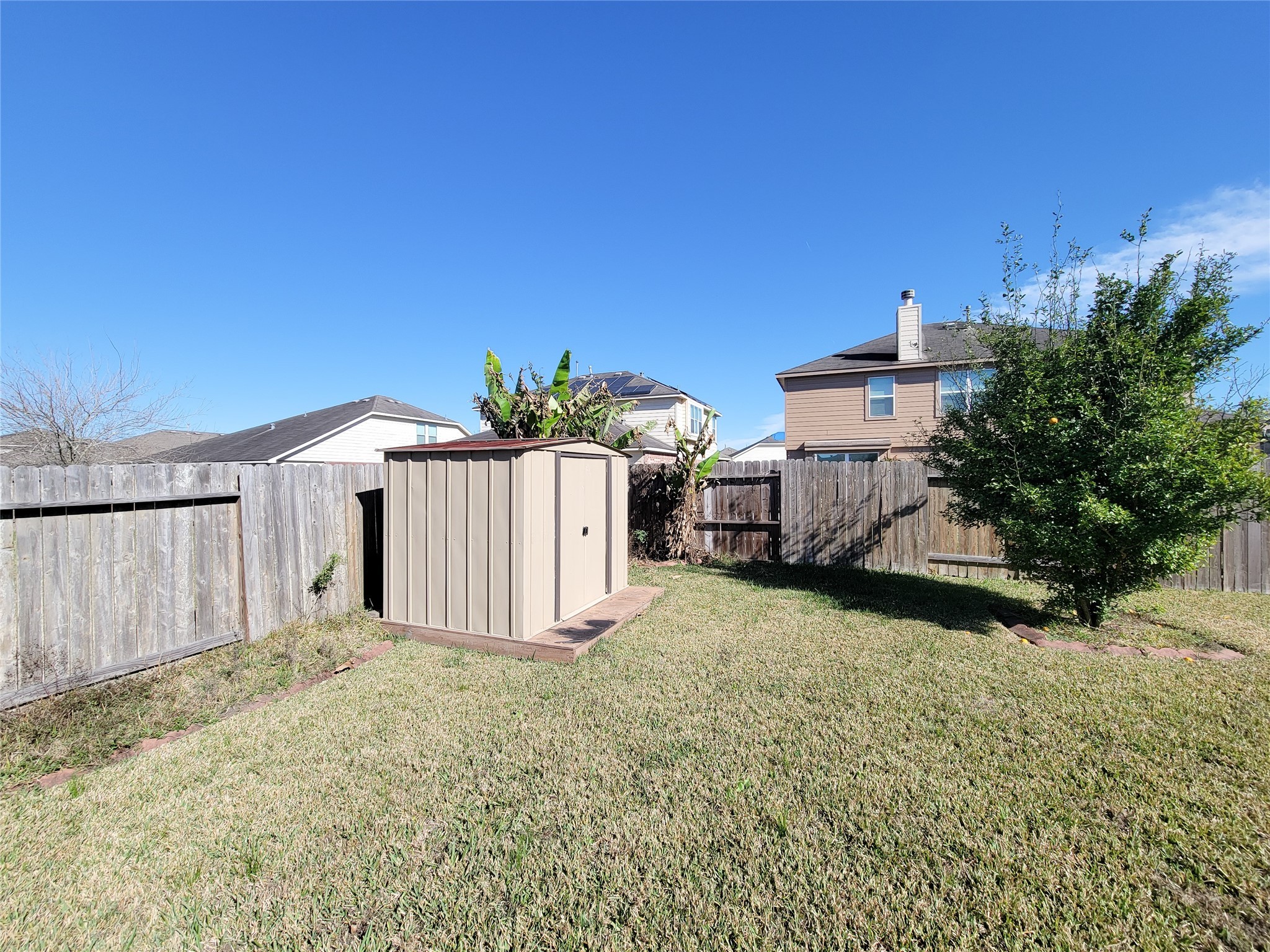 13935 Kenswick Key Lane Houston, TX 77047 - Photo 33 of 33 a front view of a house with a yard and garage
