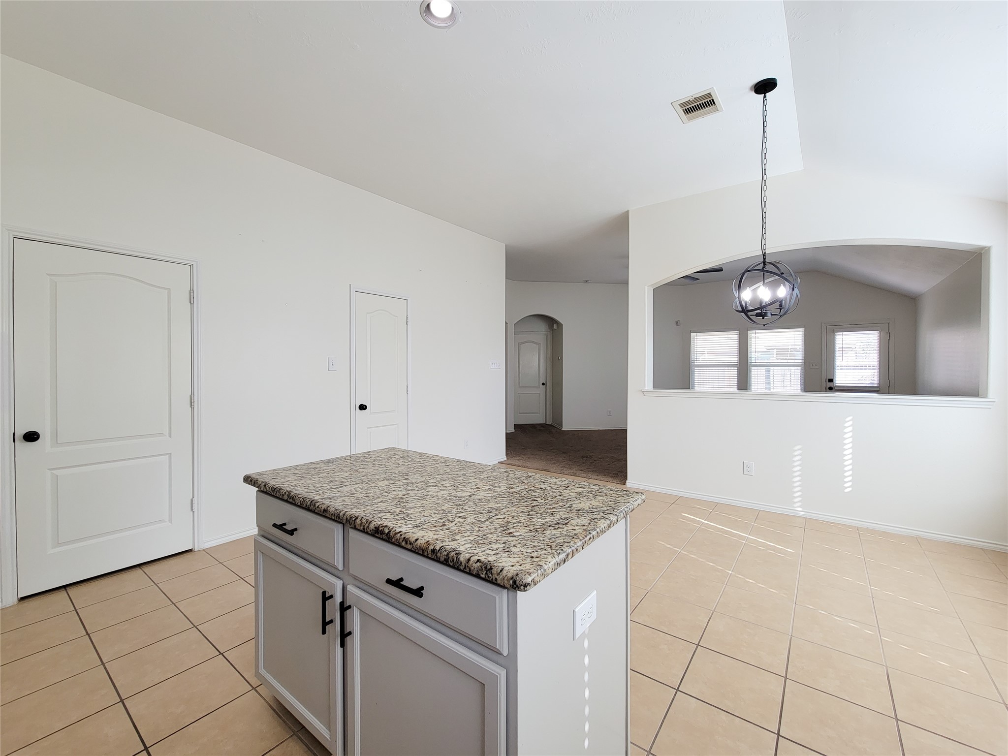 13935 Kenswick Key Lane Houston, TX 77047 - Photo 7 of 33 a kitchen with a granite countertop sink and refrigerator