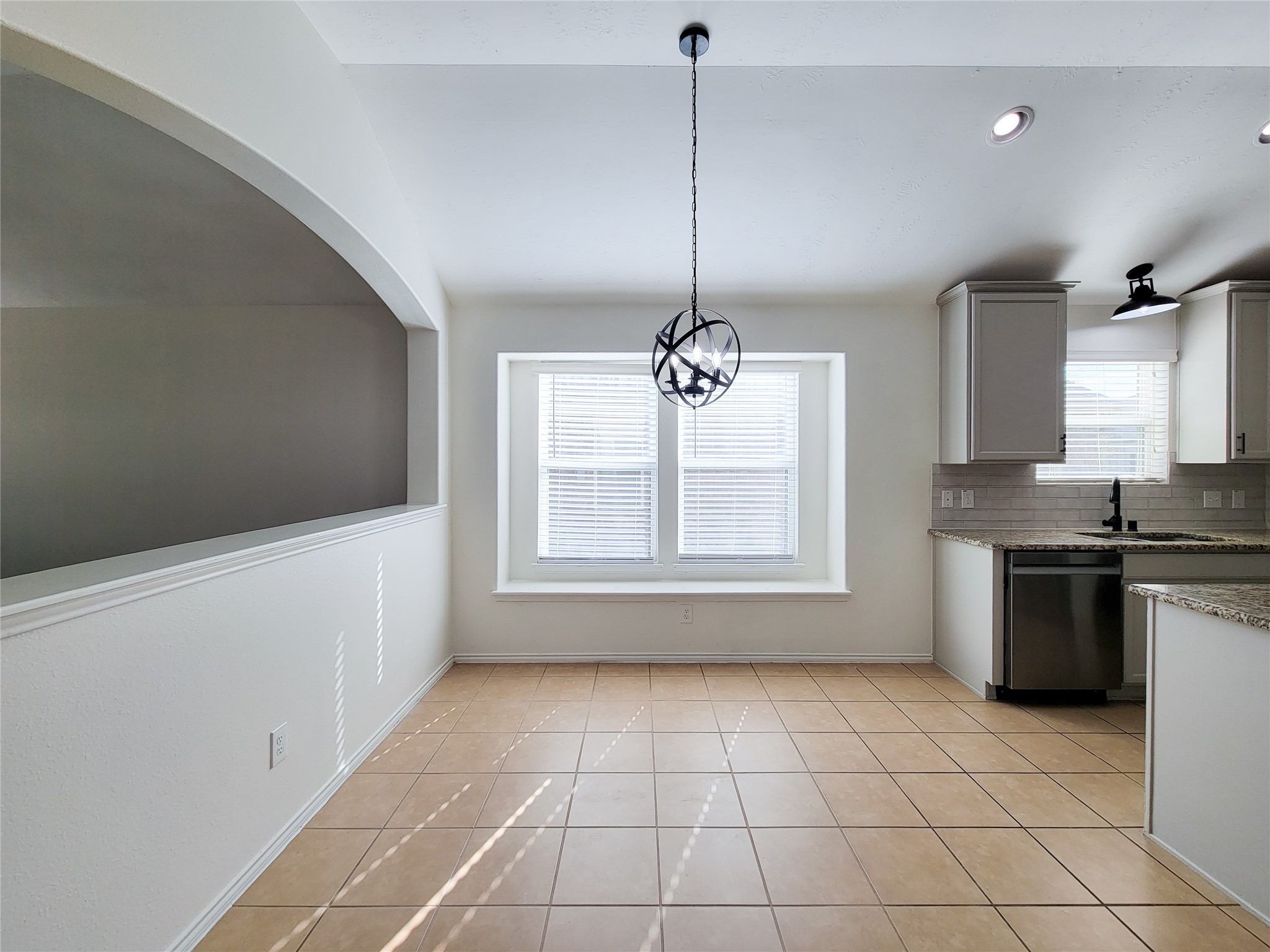 13935 Kenswick Key Lane Houston, TX 77047 - Photo 8 of 33 a view of an empty room with a kitchen