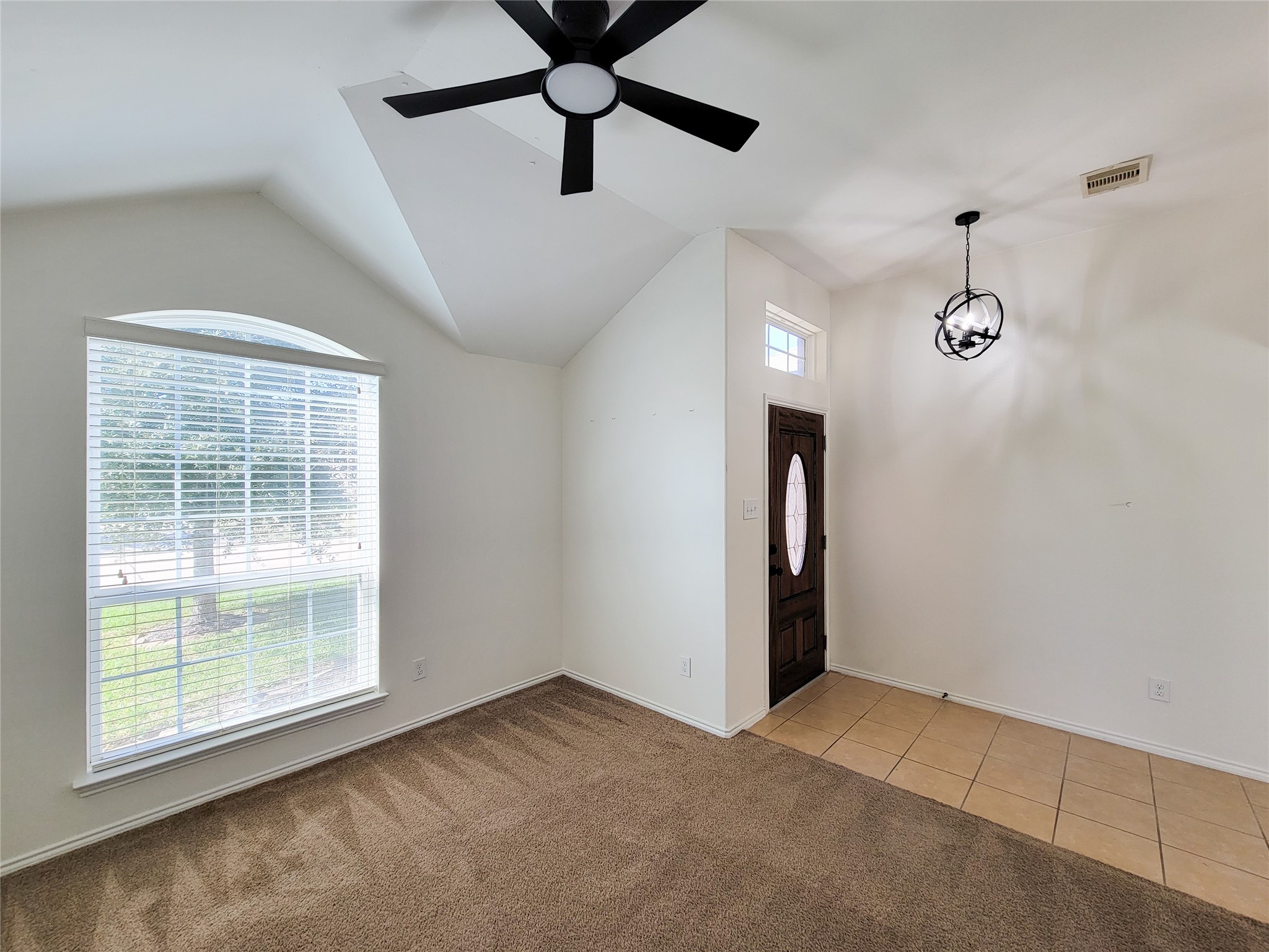 13935 Kenswick Key Lane Houston, TX 77047 - Photo 10 of 33 an empty room with fan and windows
