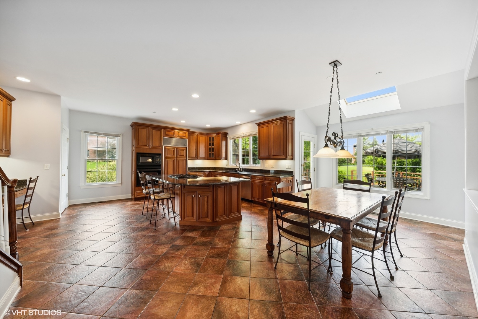 23914 Hillfarm Road Lake Barrington, IL 60010 - Photo 16 of 43 a view of a dining room and livingroom with furniture wooden floor a chandelier