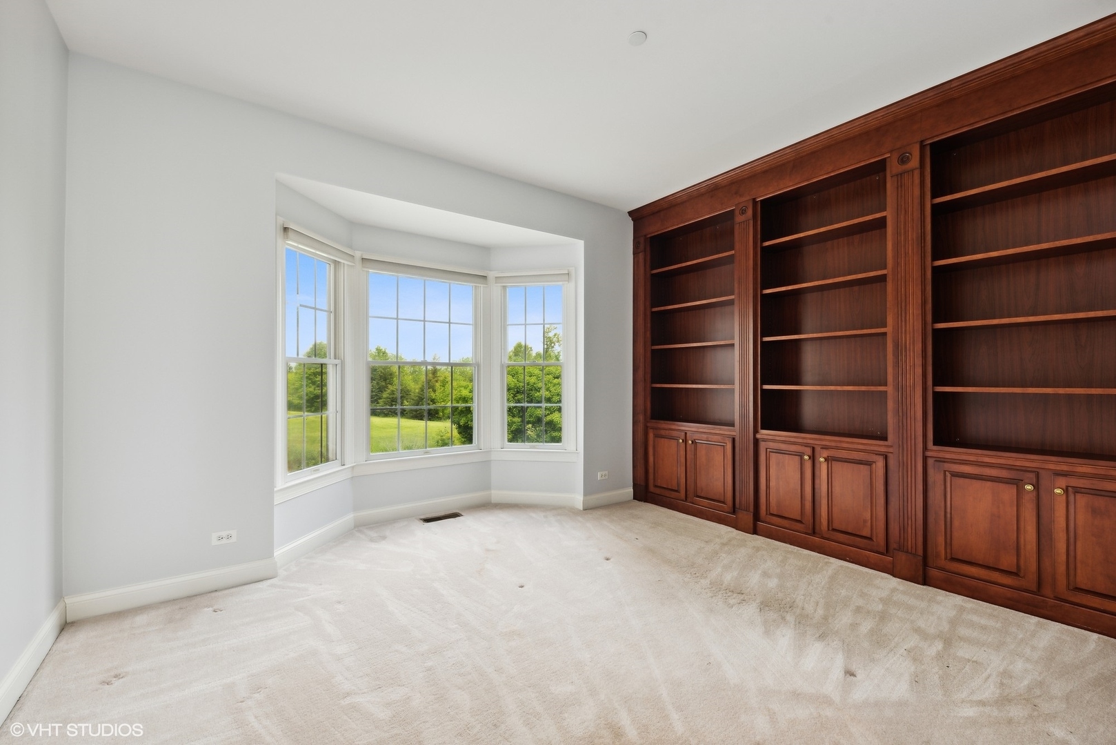 23914 Hillfarm Road Lake Barrington, IL 60010 - Photo 17 of 43 a view of an empty room with a fireplace and cabinets