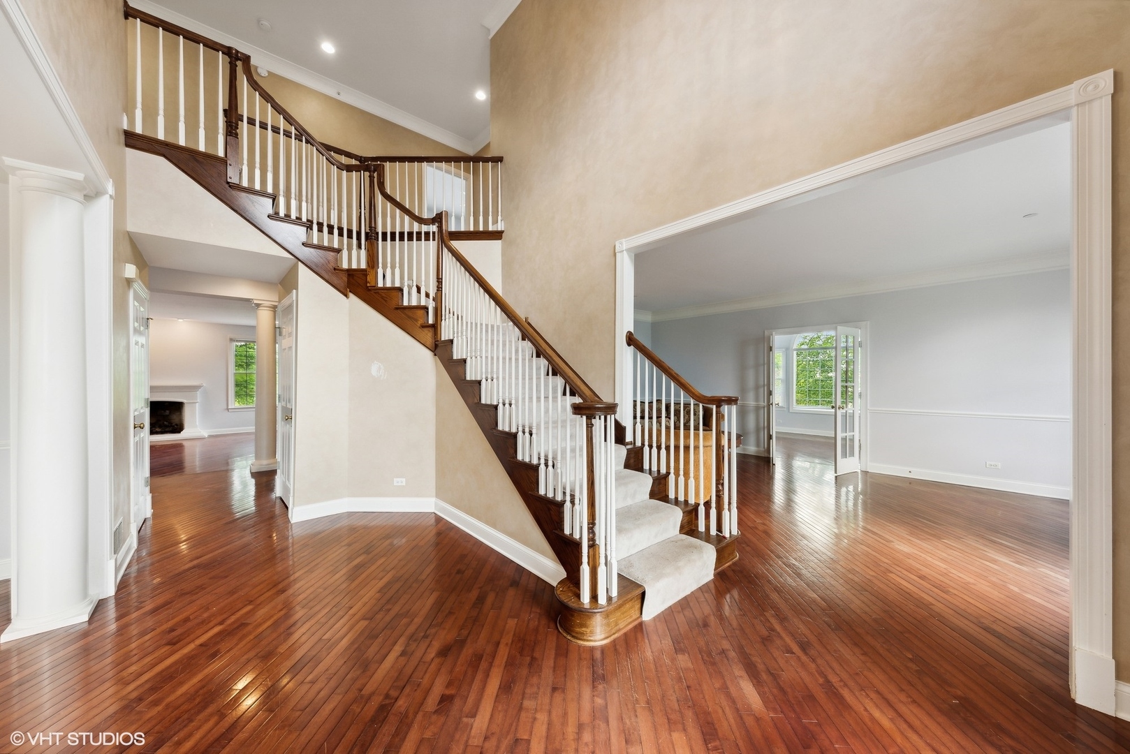 23914 Hillfarm Road Lake Barrington, IL 60010 - Photo 8 of 43 a view of staircase with wooden floor and a chandelier