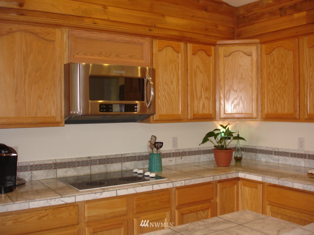 15112 Littlerock Road Southwest Rochester, WA 98579 - Photo 8 of 15 a kitchen with a sink and a window