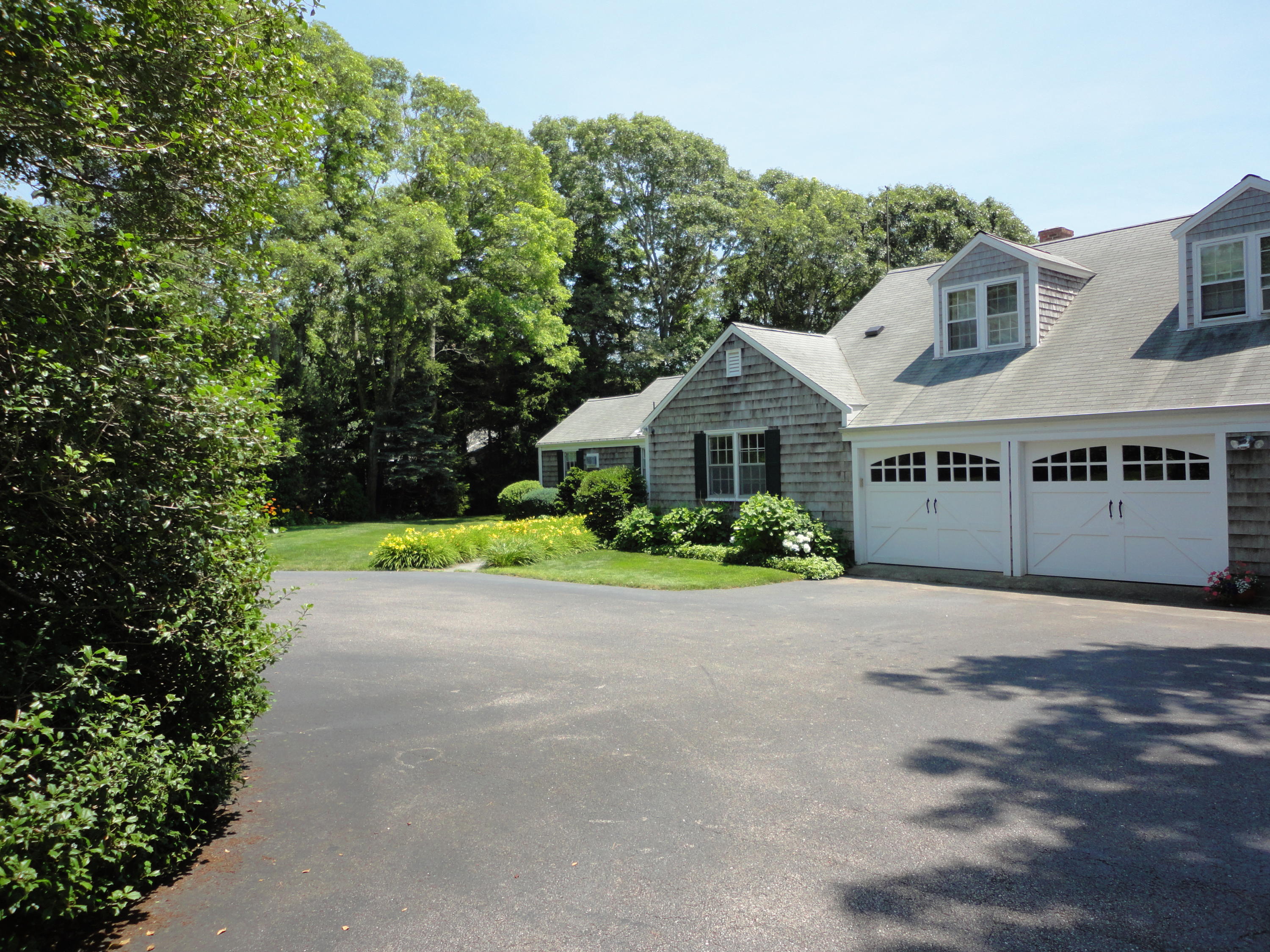 247 Crystal Lake Road Osterville, MA 02655 - Photo 2 of 34 a view of an house with backyard and garden