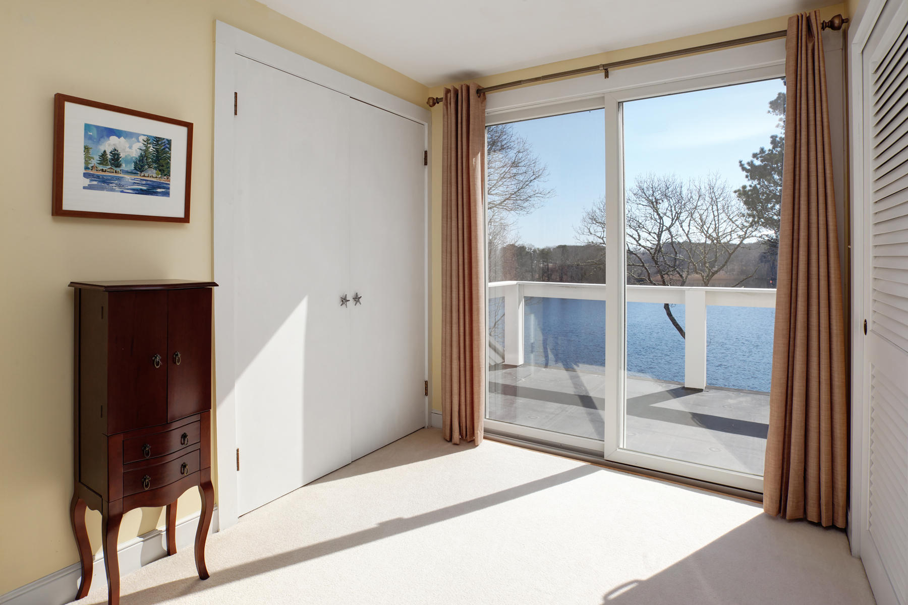 247 Crystal Lake Road Osterville, MA 02655 - Photo 31 of 34 a bedroom with a bed and a large window