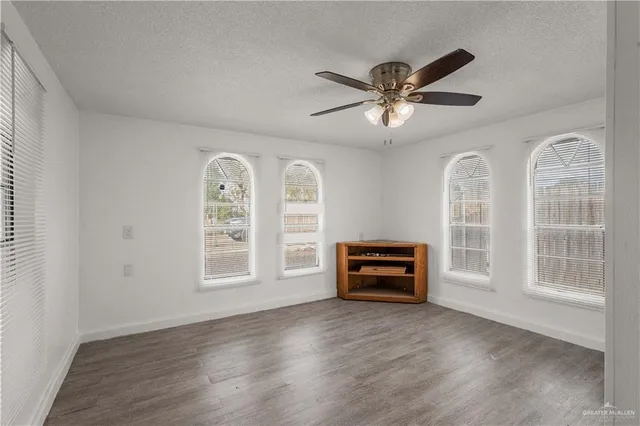 a view of livingroom with furniture ceiling fan and wooden floor