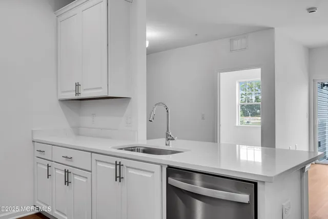a view of cabinets with wooden floor