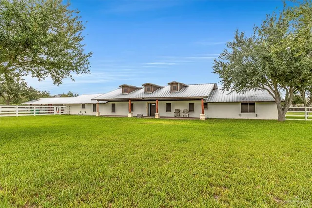 a view of a house with a big yard