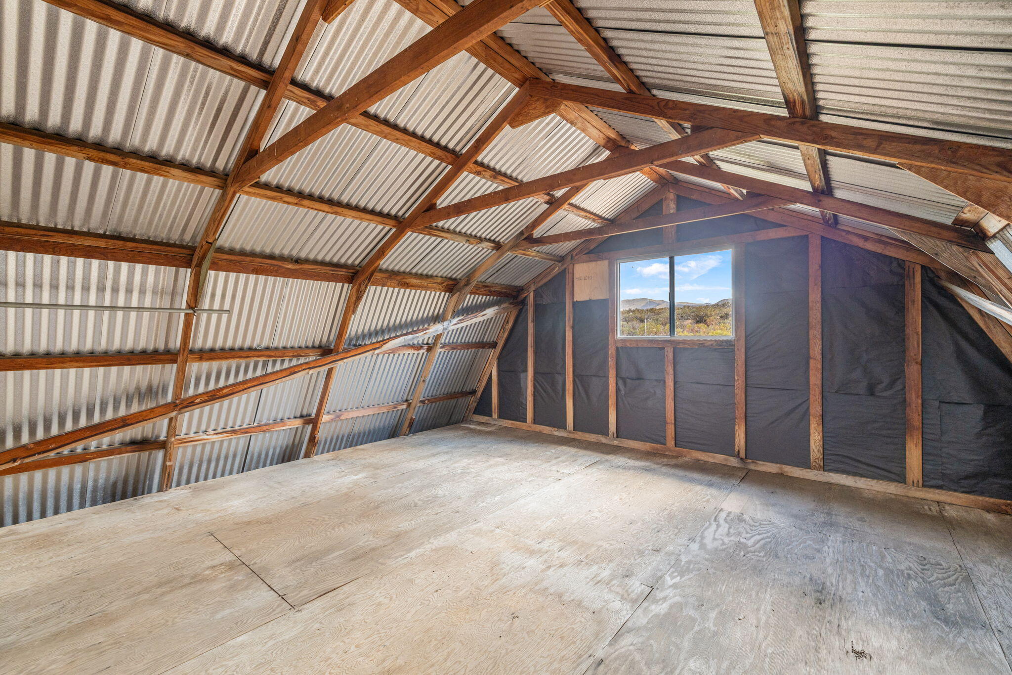 58700 Mica Road Anza, CA 92539 - Photo 10 of 20 a view of an empty room with wooden floor