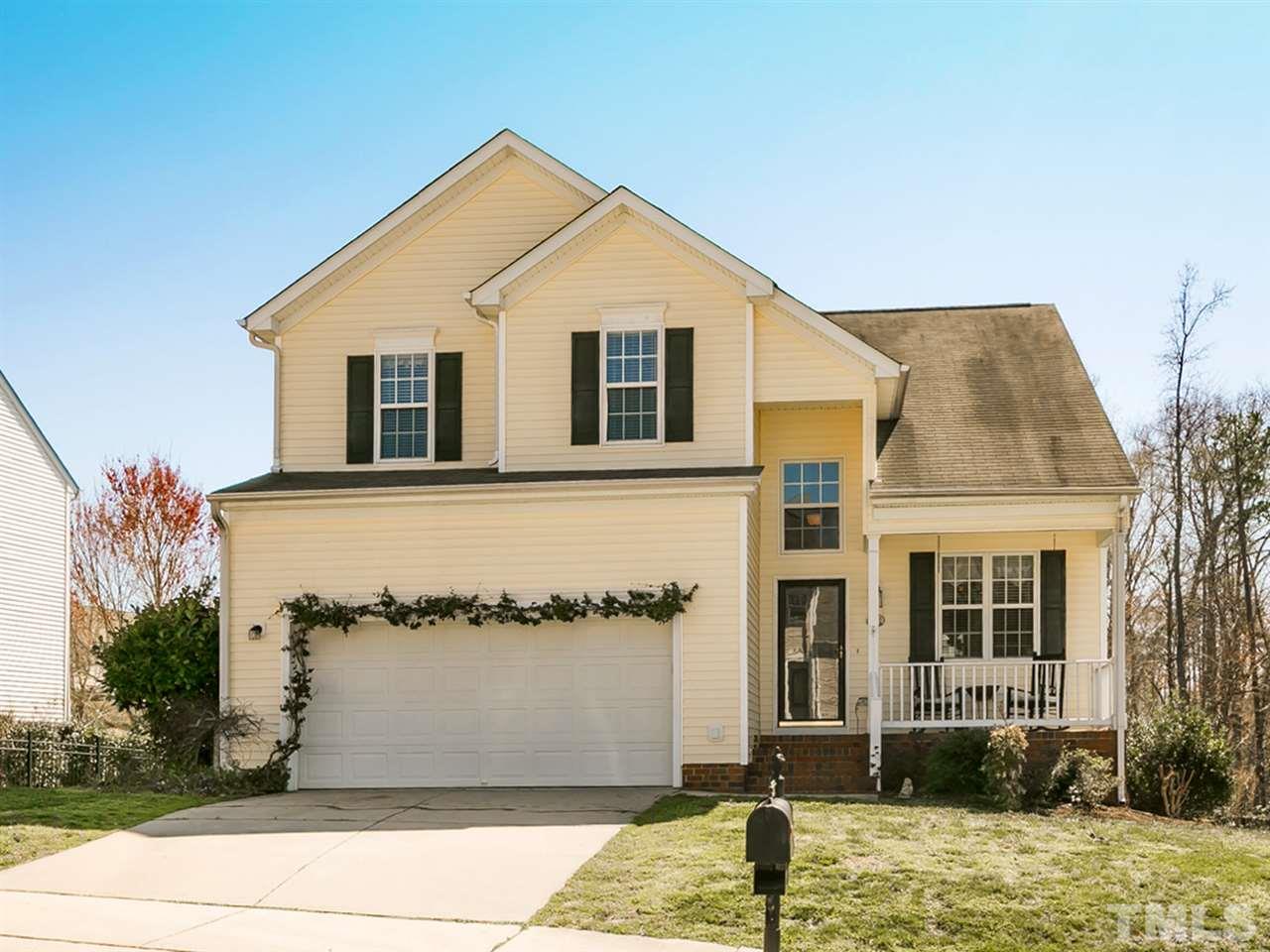 2520 Spruce Shadows Lane Raleigh, NC 27614 - Photo 1 of 25 a front view of a house with a yard