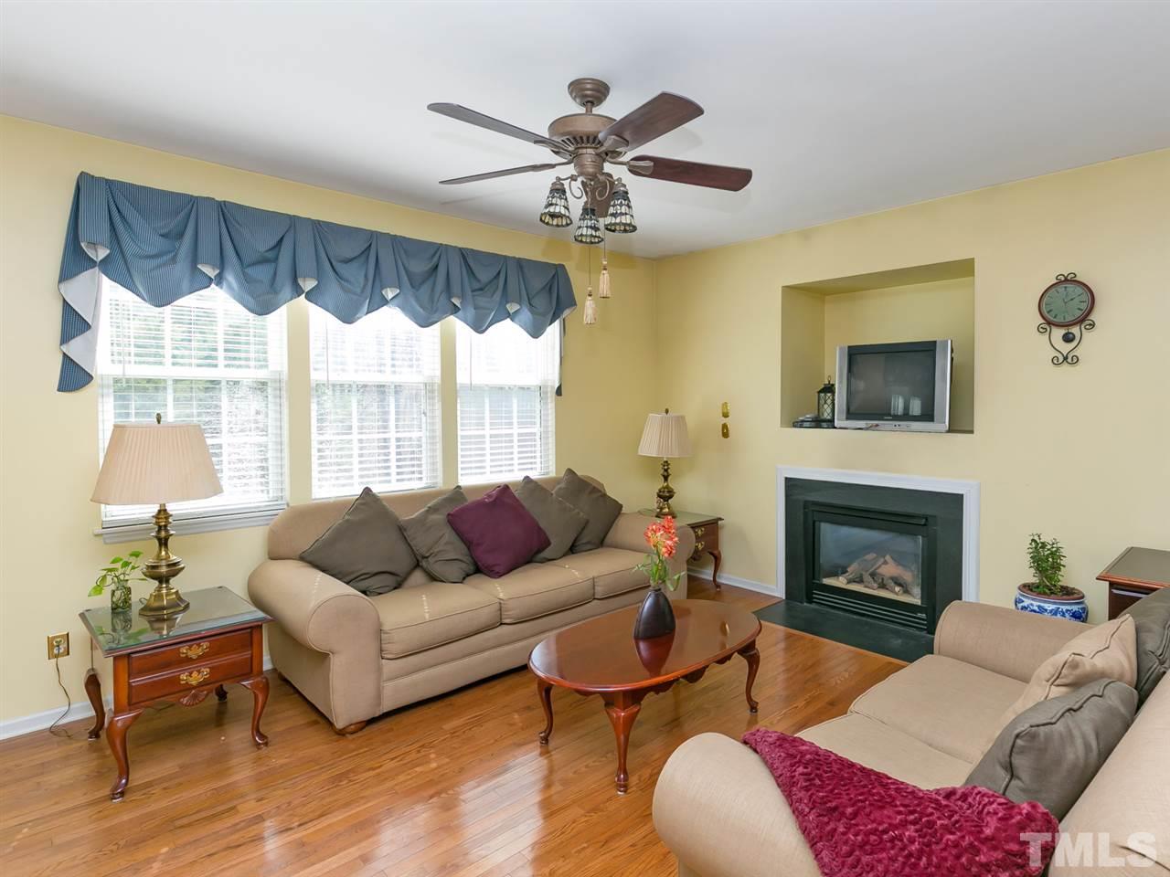 2520 Spruce Shadows Lane Raleigh, NC 27614 - Photo 2 of 25 a living room with furniture and a fireplace