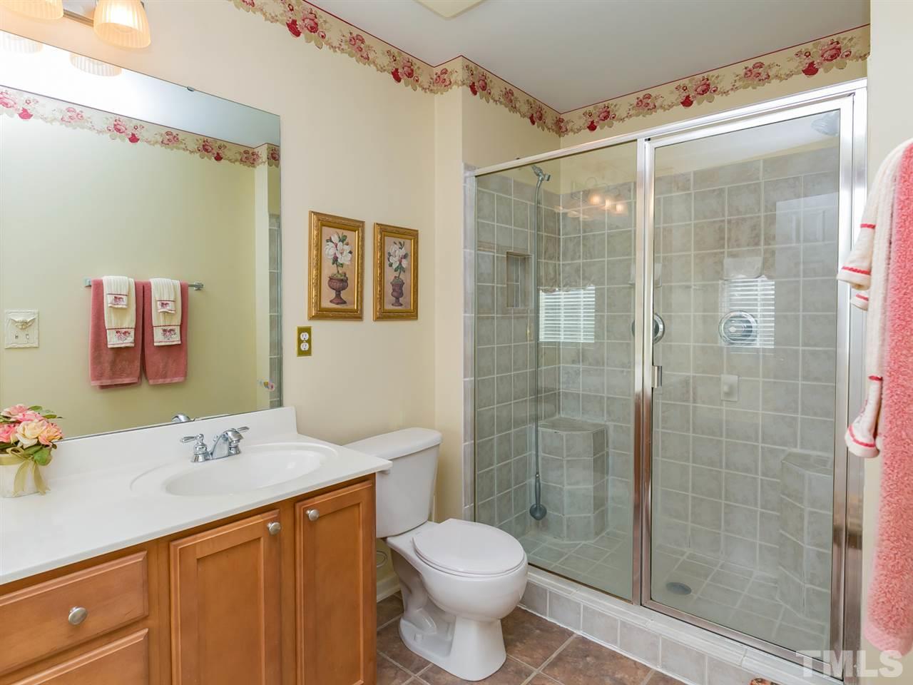 2520 Spruce Shadows Lane Raleigh, NC 27614 - Photo 13 of 25 a bathroom with a sink toilet and shower