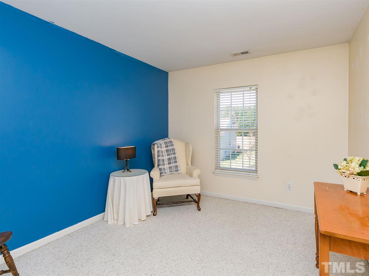 2520 Spruce Shadows Lane Raleigh, NC 27614 - Photo 14 of 25 a view of wooden floor and chair in a room