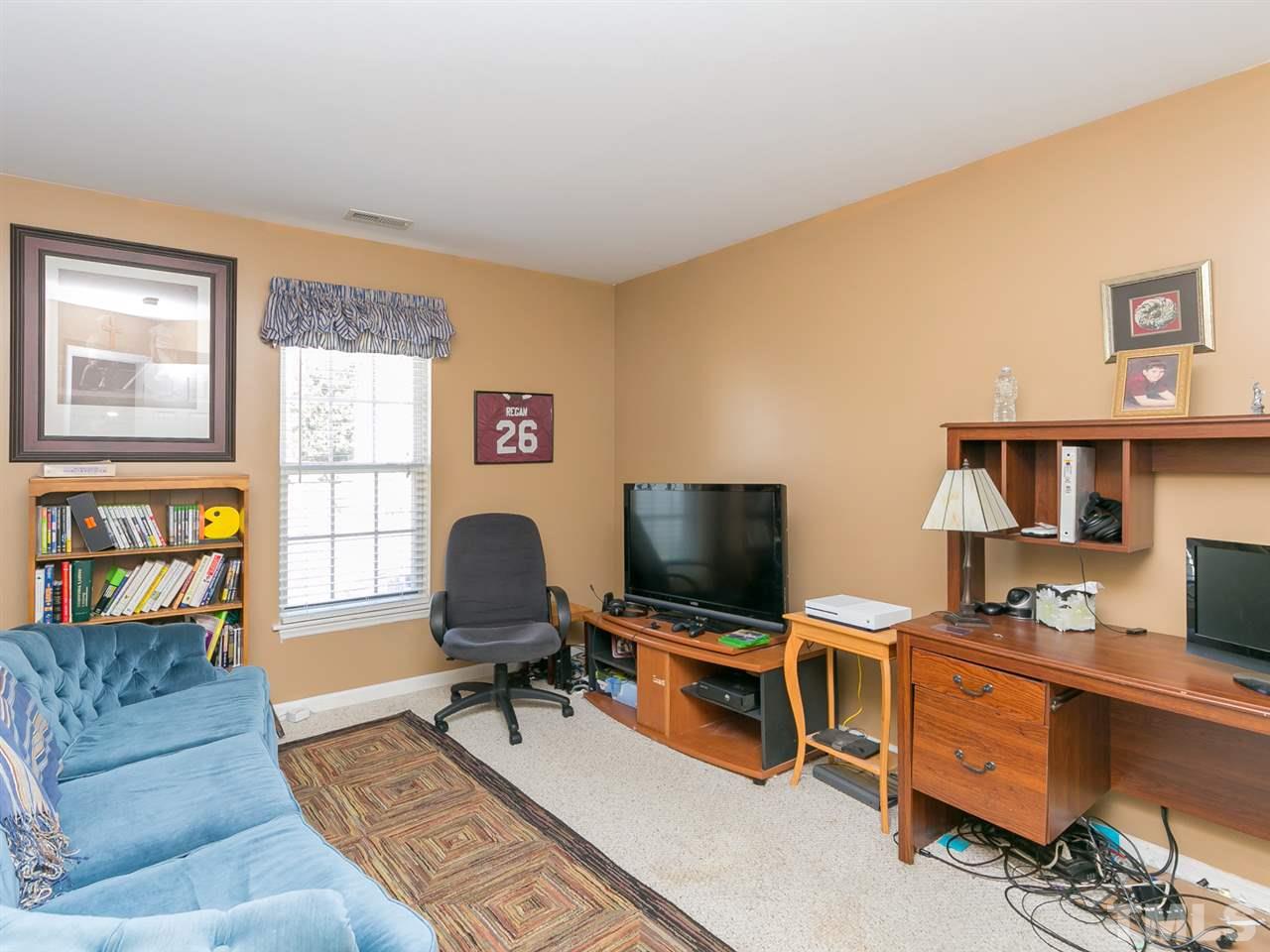 2520 Spruce Shadows Lane Raleigh, NC 27614 - Photo 15 of 25 a living room with furniture and a flat screen tv