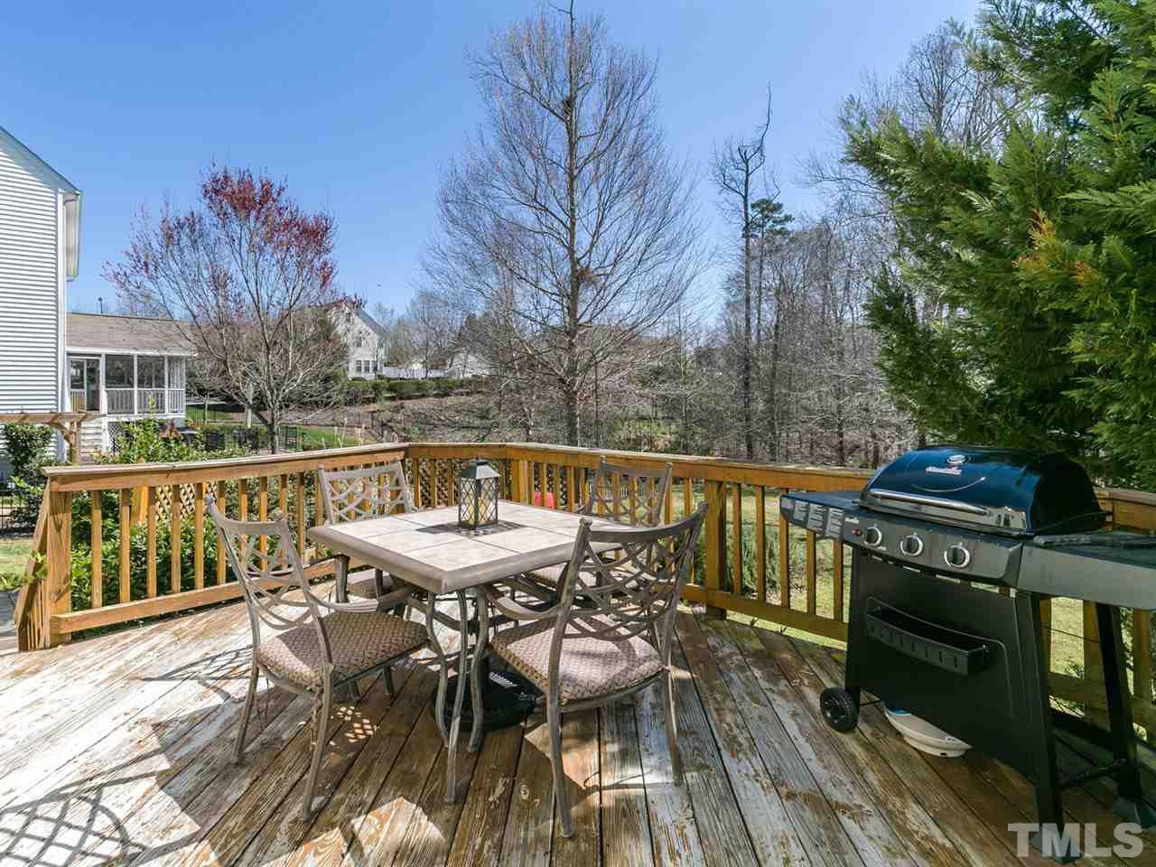 2520 Spruce Shadows Lane Raleigh, NC 27614 - Photo 17 of 25 a view of a chairs and table on the deck