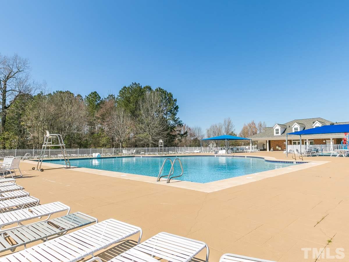 2520 Spruce Shadows Lane Raleigh, NC 27614 - Photo 23 of 25 a view of a swimming pool and an outdoor seating