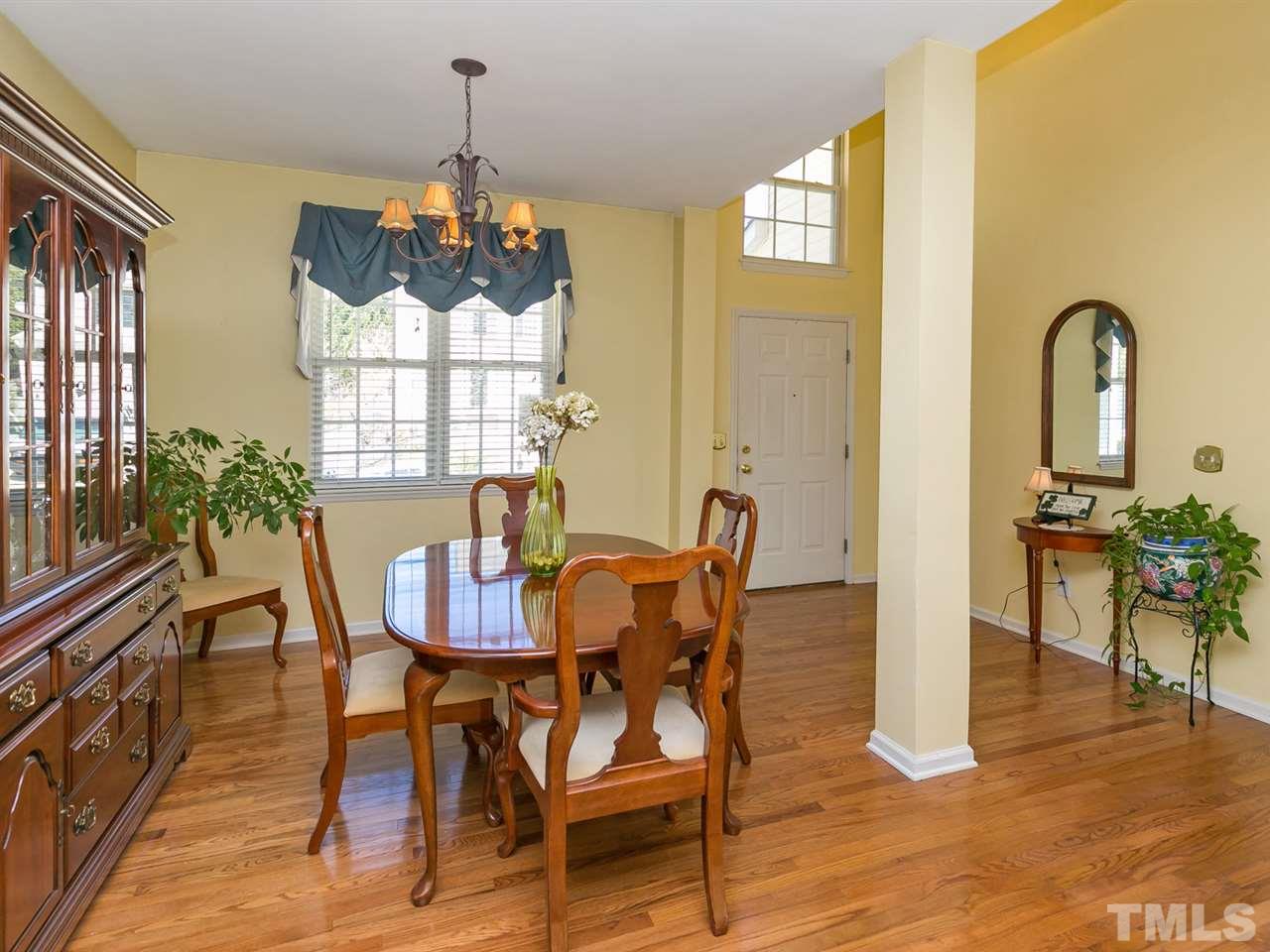 2520 Spruce Shadows Lane Raleigh, NC 27614 - Photo 5 of 25 a dining room with furniture a chandelier and wooden floor