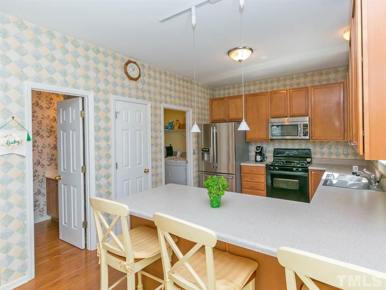 2520 Spruce Shadows Lane Raleigh, NC 27614 - Photo 8 of 25 a kitchen with stainless steel appliances granite countertop a refrigerator and a stove top oven