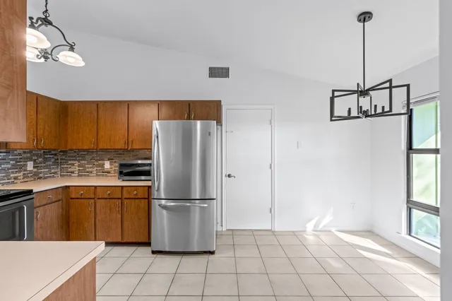 a kitchen with appliances cabinets and a sink