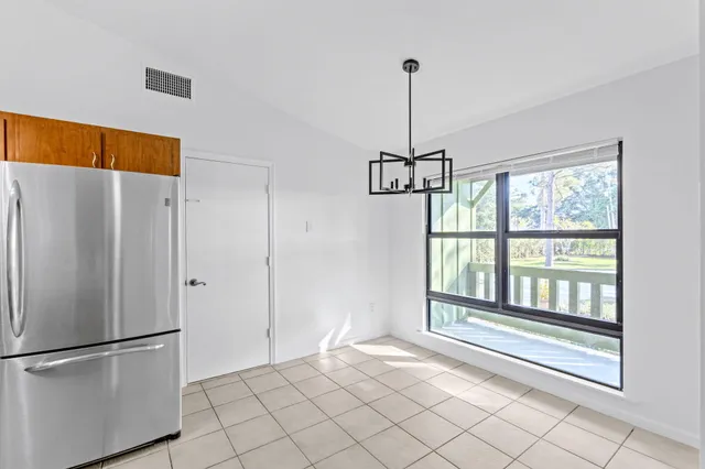 a kitchen with a sink cabinets and appliances