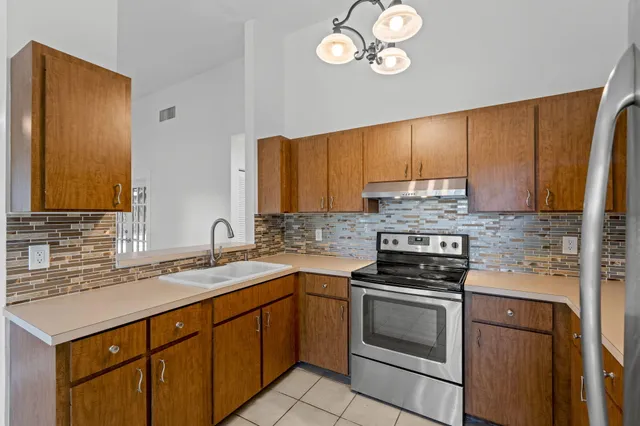 a view of a livingroom with a ceiling fan and window