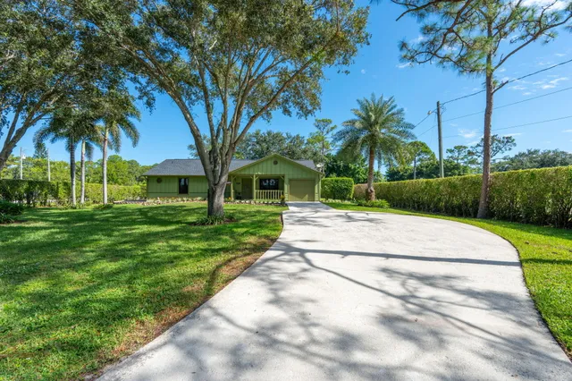 a view of a hallway with seating area