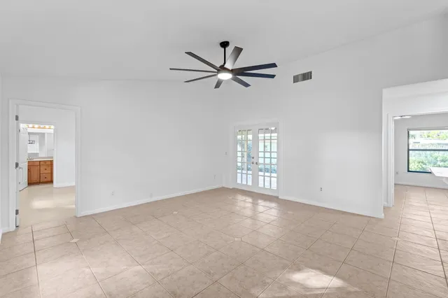 a view of a porch with furniture and a yard