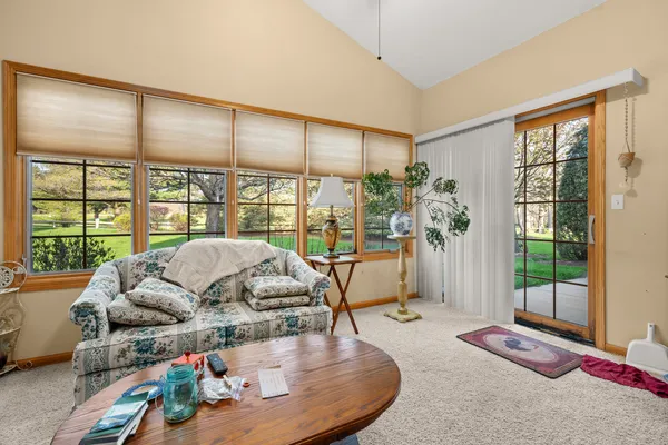 a living room with furniture and a large window