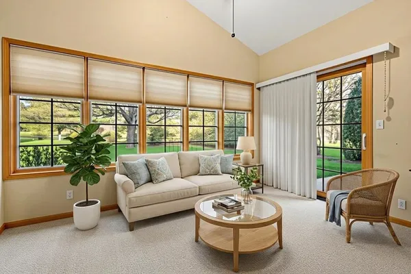 a kitchen with stainless steel appliances a stove a sink a microwave a refrigerator and cabinets