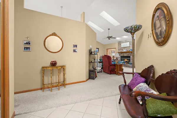 a living room with furniture and a chair