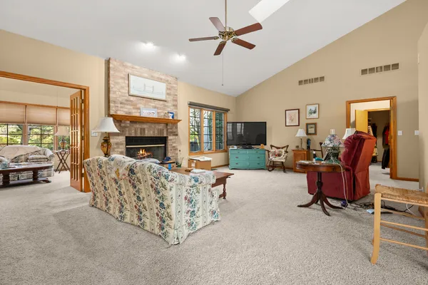 a living room with furniture and a fireplace